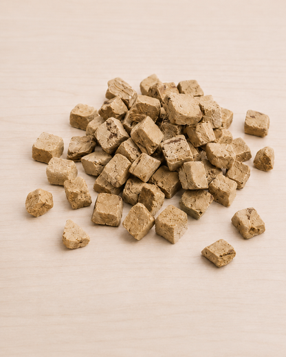 Allgood freeze dried dog treats  on a light beige surface.