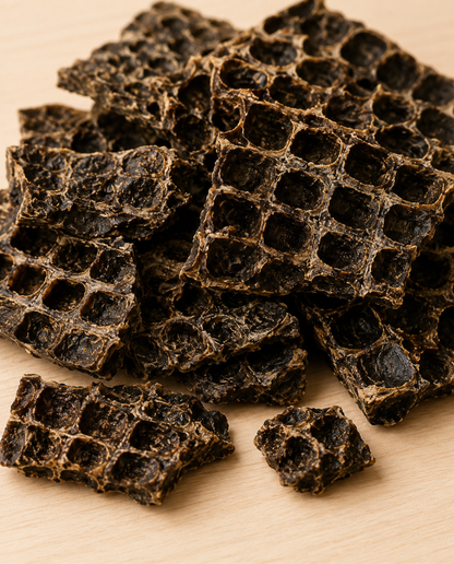 Allgood beef liver dog treats on a light wood surface.