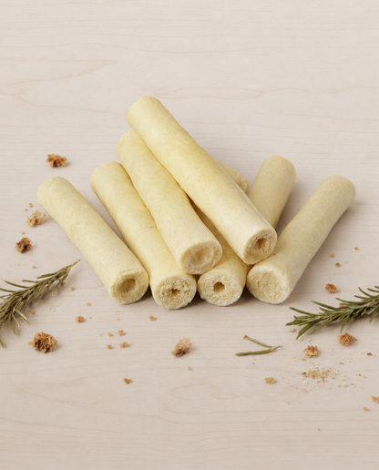 Allgood beef tails on a beige surface with rosemary leaves.