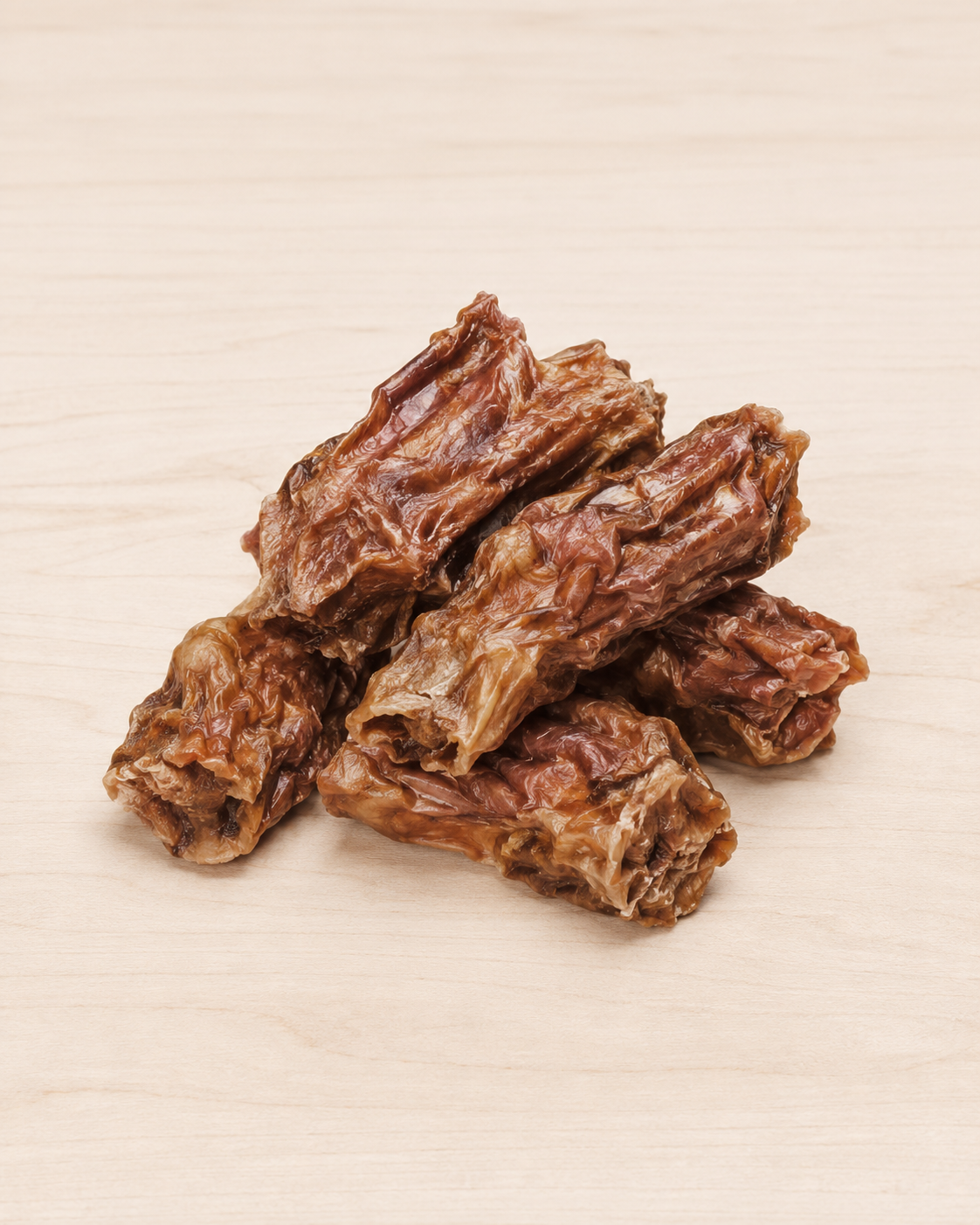 Allgood dog treat trainers, arranged on a light beige wood-grain surface.
